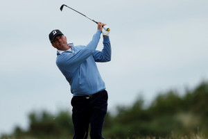 Kuchar leads in clubhouse as challengers face elements